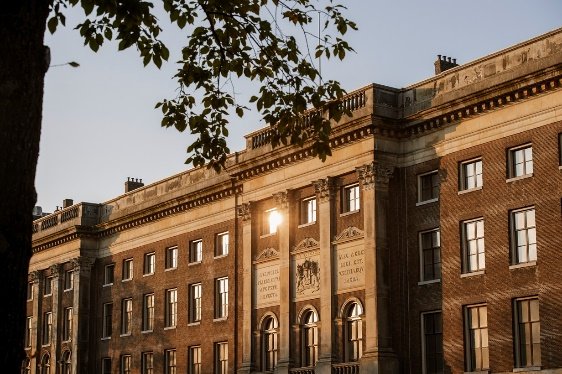 A building with a sun shining through the windows
AI-generated content may be incorrect.